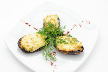 Grilled mussels with roasted cheese isolated on white.