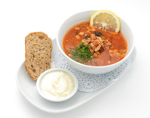Russian traditional soup with mixed meat isolated on white.
