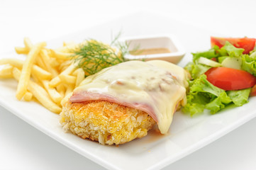 Chicken cutlet with ham and cheese isolated on white.