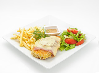 Chicken cutlet with ham and cheese isolated on white.