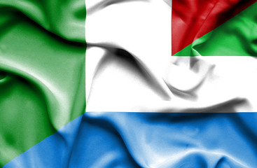 Obraz premium Waving flag of Sierra Leone and Italy
