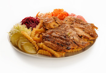 Chicken steak with French fries and vegetables