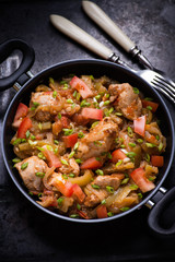Chicken stew with onion, pepper ant tomato