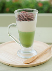 Green tea and red bean pudding in a glass
