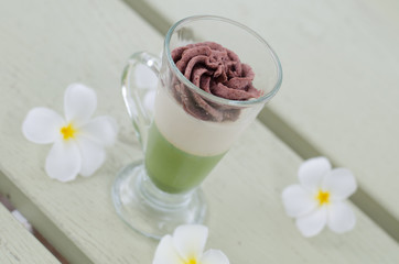 Green tea and red bean pudding in a glass