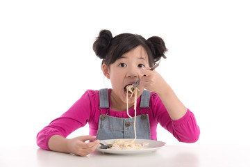 Cute asian girl eating Spaghetti Carbonara