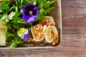 Arugula salad with goat cheese honey and nuts