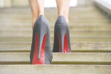 Walking up steps in high heel shoes