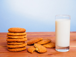 Oatmeal cookies and glass with milk