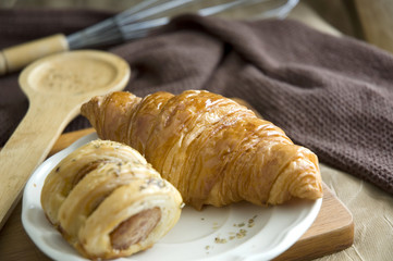 delicious croissant and sausage roll