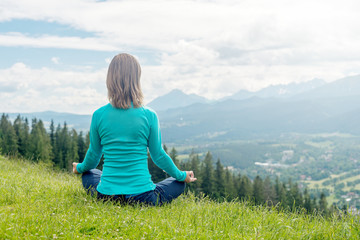 Woman Meditate at the Mountains