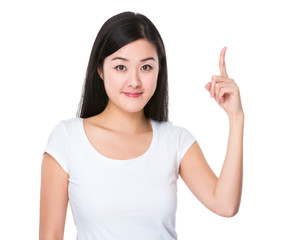 Fototapeta premium Asian young woman with finger point upwards