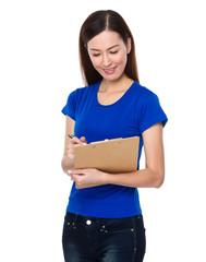 Young Woman write on clipboard