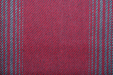 Handmade fabric with red texture. Clothes background