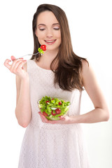 isolated a beautiful girl with salad on white background