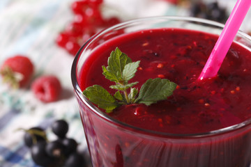 Fresh Smoothies of raspberry and currants macro. horizontal
