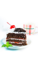 Chocolate cake delicious decorated with whipped cream and cherri