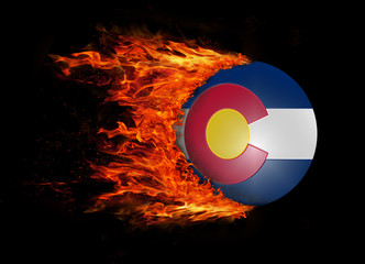 US state flag with a trail of fire - Colorado