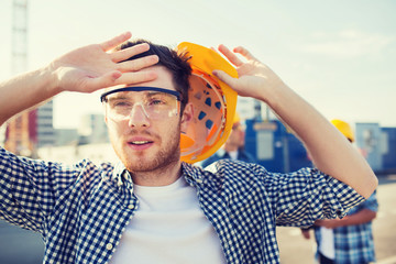 group of builders in hardhats outdoors