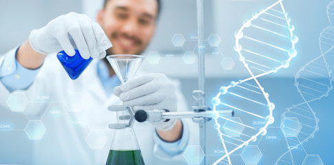 close up of scientist with test tubes and funnel