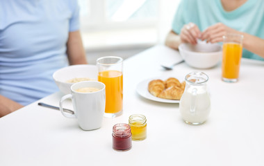 close up of couple having breakfast at home