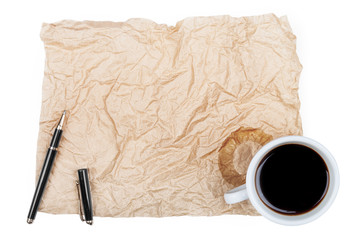 Blank white paper with pen and a half-empty cup of coffee,