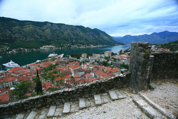 building red rooftops European town on the coast