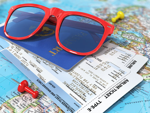 Travel concept. Passports, airline tickets and sunglasses on the