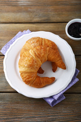 Croissant on plate and jam