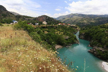 mountain landscape with mountain turbulent river in the gorge