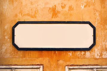 Blank Vintage Advertising Board on Old Wall