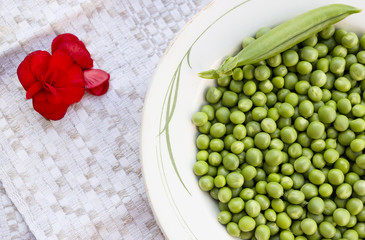 Green peas on the vintage linen background