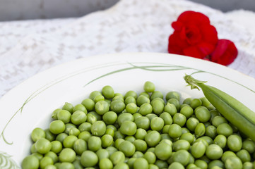 Green peas on the vintage linen background