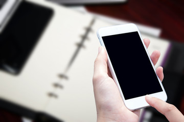 woman hand hold and touch screen smart phone