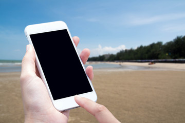 woman hand hold and touch screen smart phone