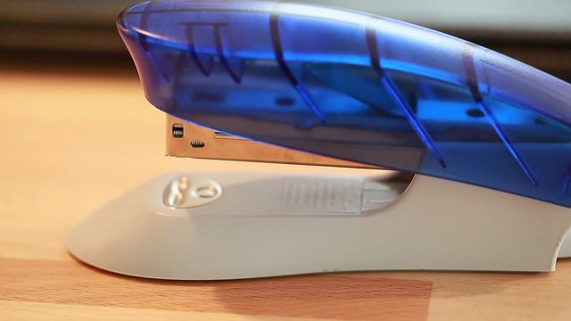 hand using a stapler