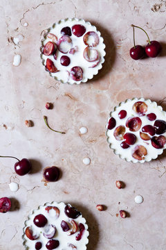 three cherries clafoutis from above on marble surface