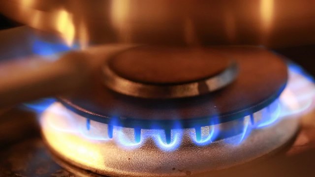 a flame on a gas stove in kitchen