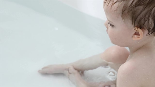 Toddler passes gas in bath tub