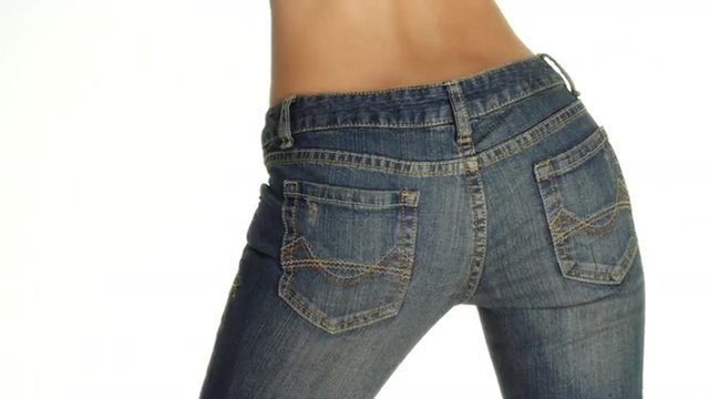 Rear view of woman wearing denim jeans