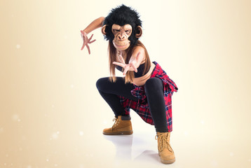Woman with monkey mask dancing