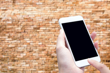 woman hand hold and touch screen smart phone