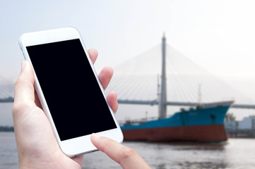 woman hand hold and touch screen smart phone