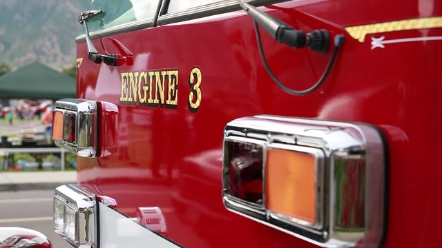 Fire engine parked on the side of a road at a festival