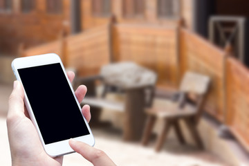 woman hand hold and touch screen smart phone