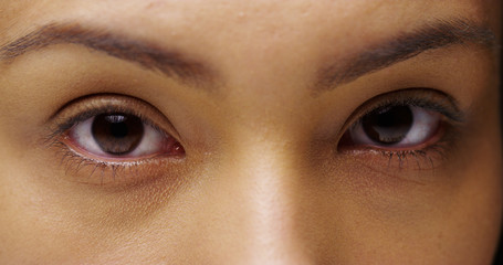 Naklejka premium Closeup of Mexican woman's beautiful eyes