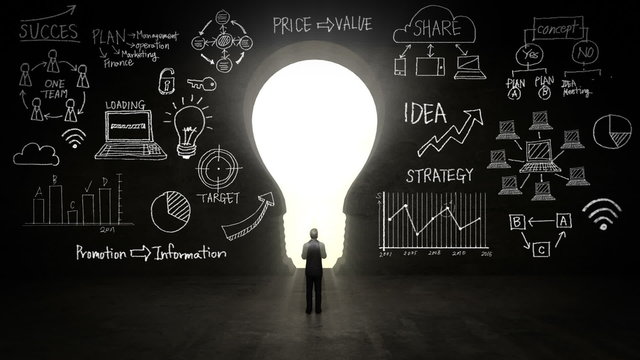 businessman Standing in front of  black, shape of bulb light, Business plan and various graph in black wall concept.