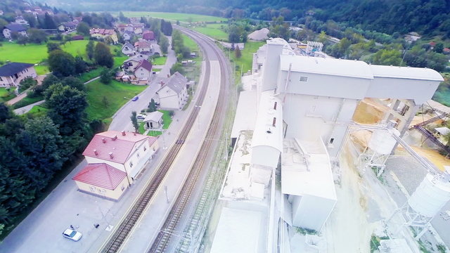 Flying over a factory where they shred sand