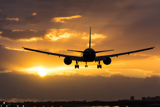 Plane flying towards the morning sun. © New Visuals