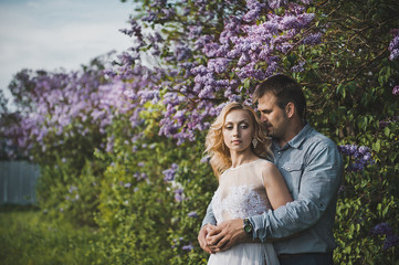 Newly-married couple among lilac bushes 3152.